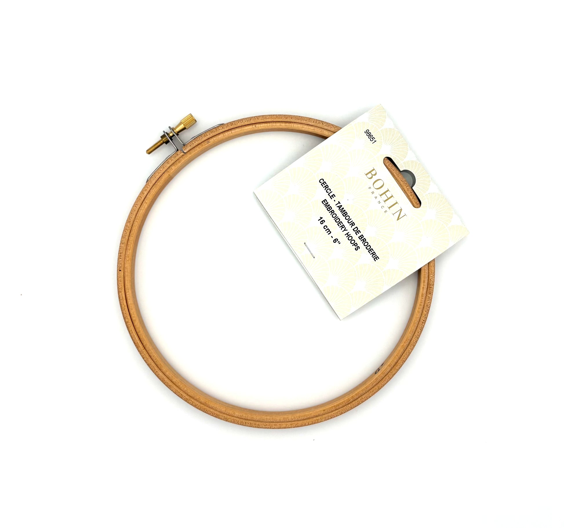 Wood circular embroidery hoop with a label on a white background