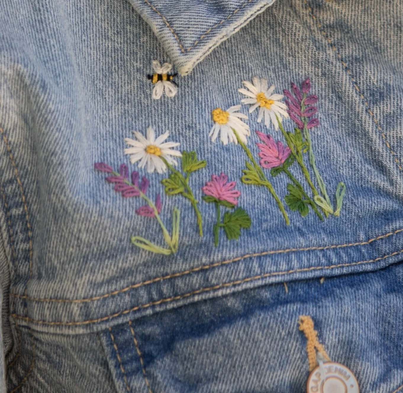 Embroidered flowers on a denim jacket