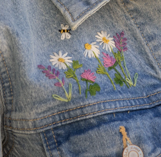 Embroidered flowers on a denim jacket