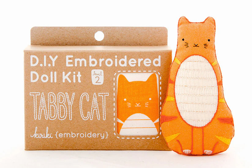 D.I.Y. Embroidered Doll Kit for a tabby cat with an embroidered tabby cat toy next to it on a white background.
