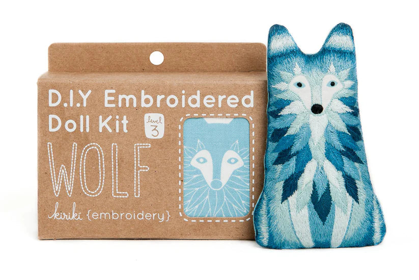 Wolf embroidered doll kit with cardboard packaging on a white background