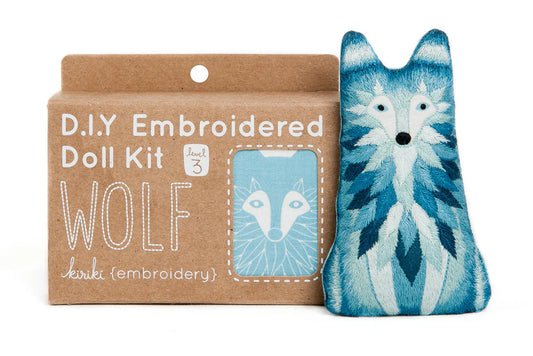 Wolf embroidered doll kit with cardboard packaging on a white background