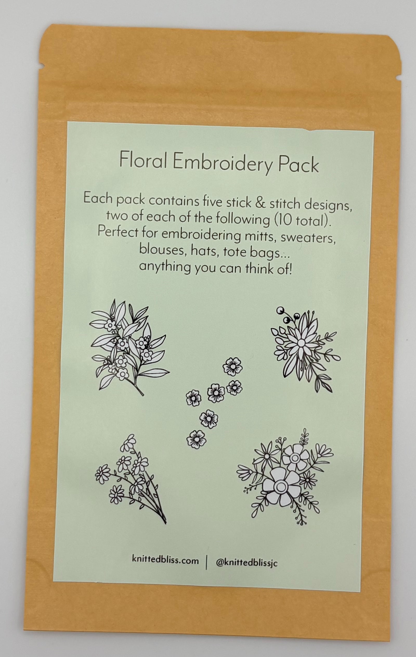 Flower Designs from Knitted Bliss on a green paper glued to an envelope