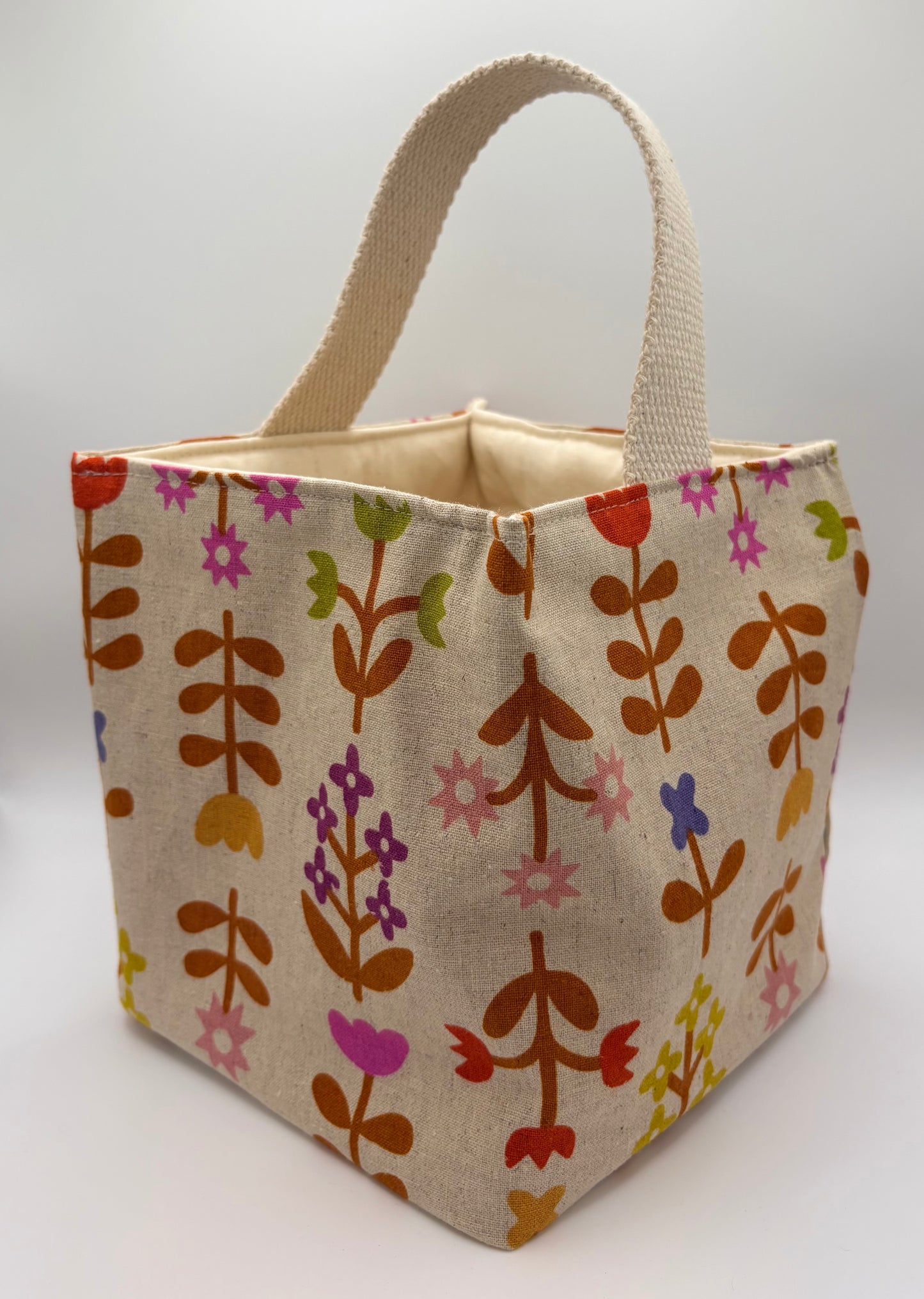 Fabric bag with a floral pattern on a white background