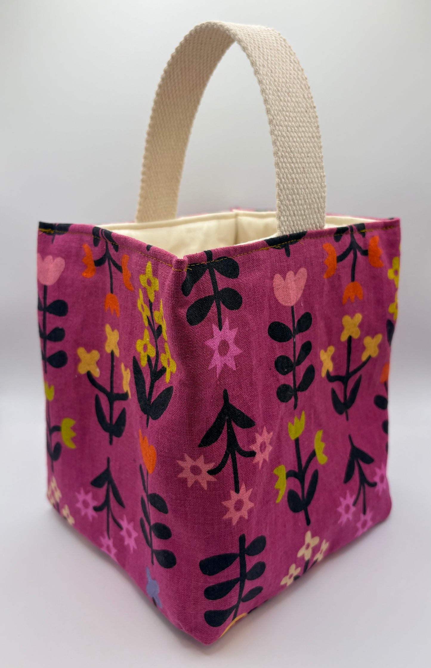 Fabric bag with a floral pattern on a white background